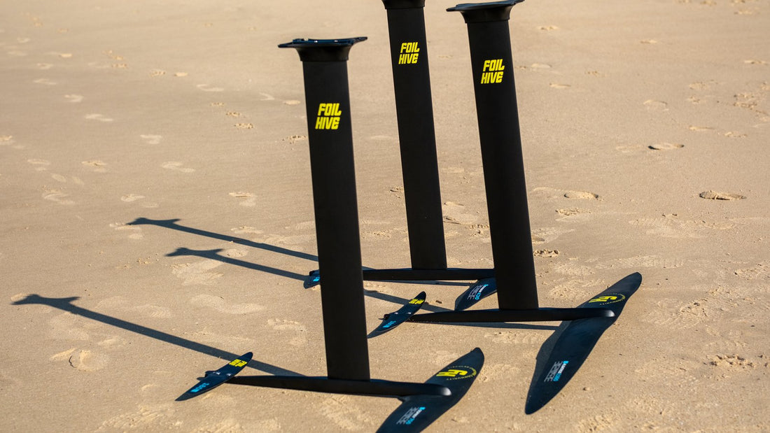 Range of foil front wings laid out on Tarifa sand