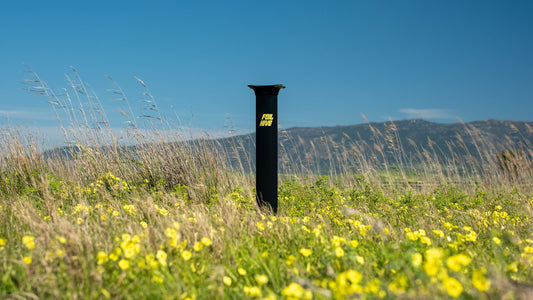 FoilHive mast standing in a wildflower field, color photograph