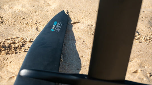 Standalone vertical foil setup on Tarifa sand, launch-ready